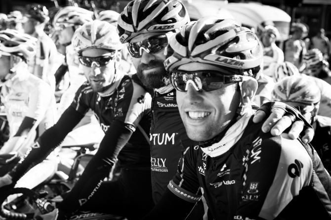 The lead-out train of Alex Candelario, Mike Friedman, and Eric Young poses for a shot at the start line for the final stage of the Vuelta a Castilla y Leon