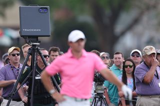Photo of a trackman with Rory Mcilroy in front of it