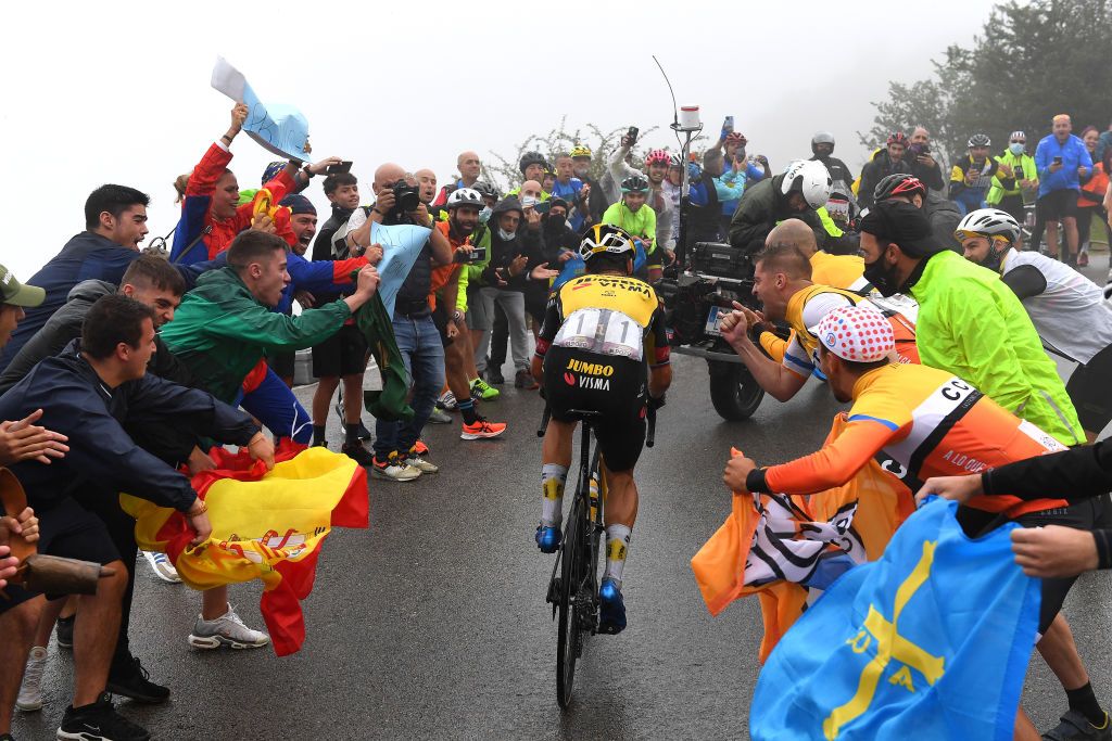 LAGOS DE COVADONGA SPAIN SEPTEMBER 01 Primoz Roglic of Slovenia and Team Jumbo Visma competes in the breakaway climbing the final hill of Lagos de Covadonga 1085m while fans cheer during the 76th Tour of Spain 2021 Stage 17 a 1855km stage from Unquera to Lagos de Covadonga 1085m lavuelta LaVuelta21 on September 01 2021 in Lagos de Covadonga Spain Photo by Tim de WaeleGetty Images