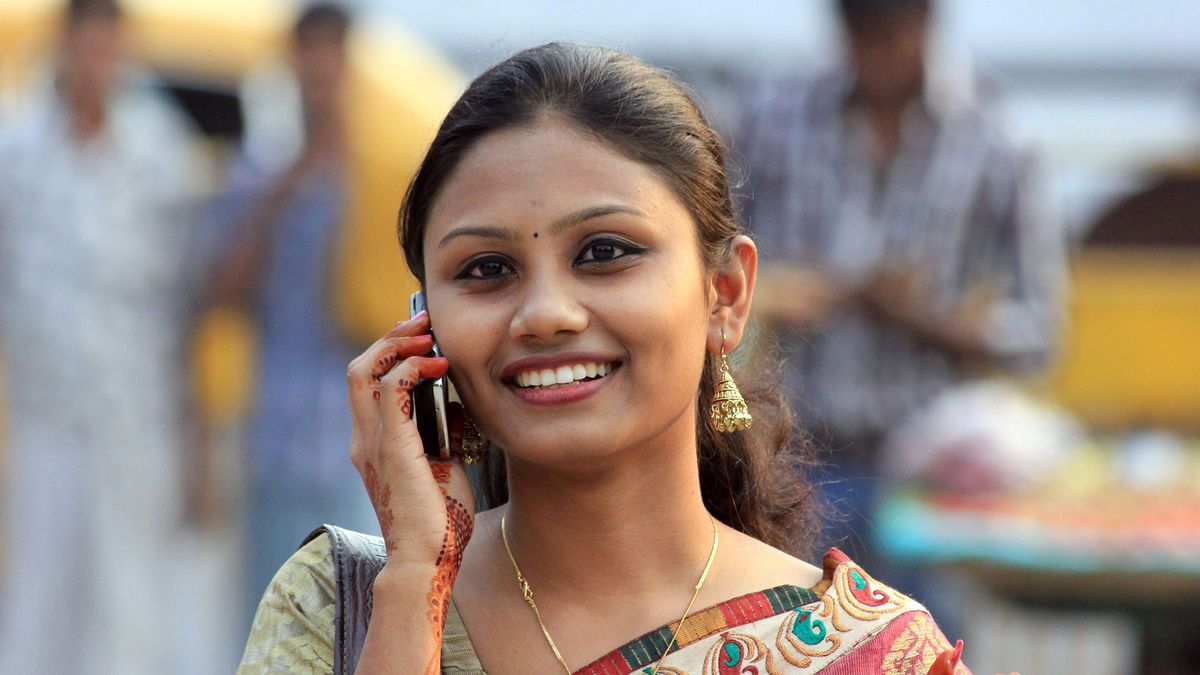 Woman using a mobile phone in India.