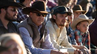 From left to right: Cole Hauser as Rip, Kevin Costner as John and Luke Grimes as Kayce watching a rode in Yellowstone.