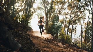 Woman running up hill