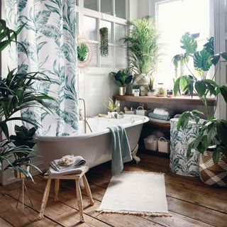 bathroom with bathtub and faux plants