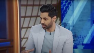 Hasan Minhaj conducting interview on The Daily Show
