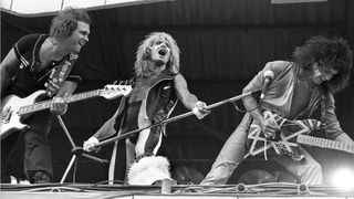 Michael Anthony, David Lee Roth and Eddie Van Halen of Van Halen perform on stage at Pinkpop Festival, Sportpark, Geleen, 26th May 1980. 