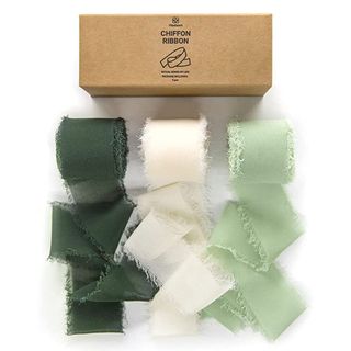 green and white ribbon, three rolls with cardboard box