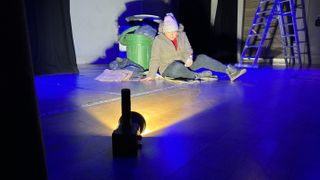 Person being lit with an orange light from a SmallRig RC 60B COB video light