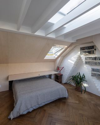 A foldaway bed that slides into the eaves