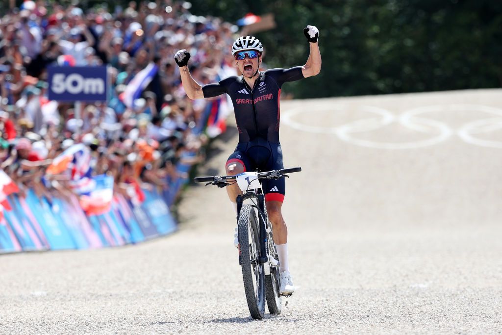 ELANCOURT FRANCE JULY 29 Thomas Pidcock of Team Great Britain celebrates at finish line as gold medal winner during the Mens CrossCountry on day three of the Olympic Games Paris 2024 at Elancourt Hill on July 29 2024 in Elancourt France Photo by Alex BroadwayGetty Images