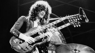 Jimmy Page performs live on stage in Germany in March 1973. He is using a Gibson EDS-1275 double-neck 12- and 6-string solidbody electric guitar.
