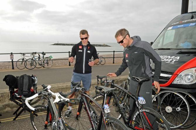 Team IG Sigma Sport mechanics preparing bikes on the Sidmouth promenade