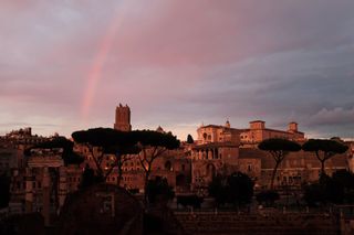 This photo taken on November 3, 2017 shows a rainbow over the city of Rome during a sunset. / AFP PHOTO / Alberto PIZZOLI(Photo credit should read ALBERTO PIZZOLI/AFP/Getty Images)