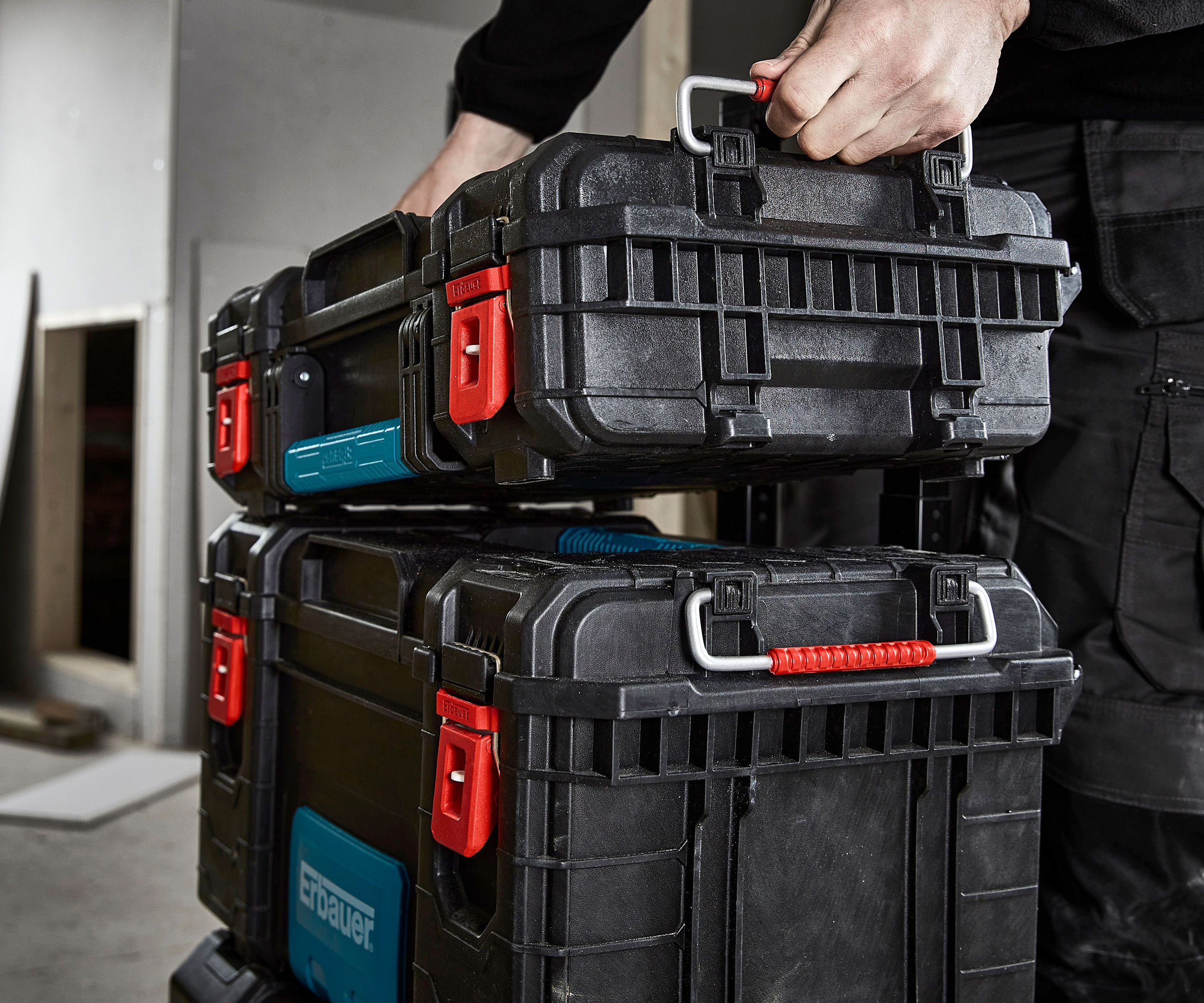 Black stackable tools boxes on top of one another