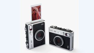 A product shot of the Fujifilm Instax Mini Evo camera on a white background