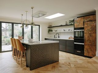 A kitchen using copper metal for cabinets