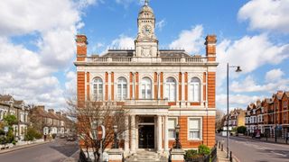 A ground-floor flat in an Italianate brick-and-stone building.