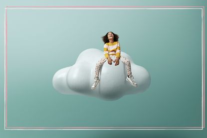 A young girl sat on a floating cloud