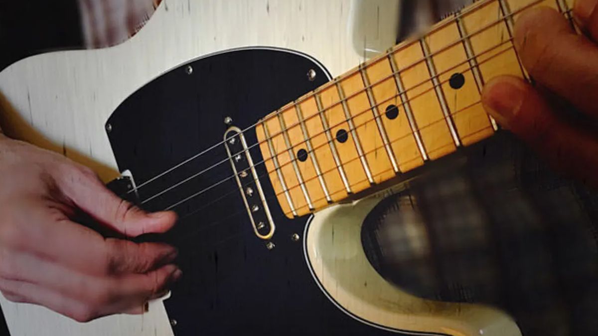 Man chicken pickin&#039; on his Fender Telecaster