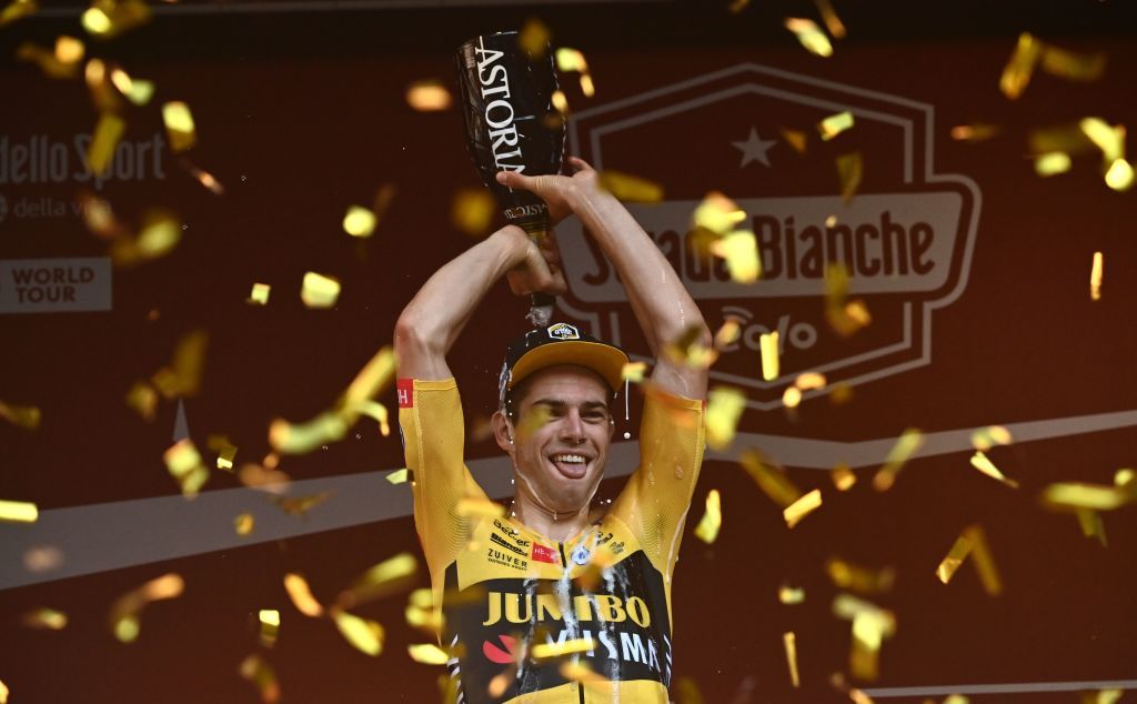 Team JumboVisma Belgian rider Wout van Aert celebrates on podium after the oneday classic cycling race Strade Bianche White Roads on August 1 2020 in Siena Tuscany Photo by Marco BERTORELLO AFP Photo by MARCO BERTORELLOAFP via Getty Images