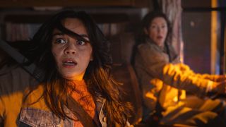 Two shocked women looking out of a truck's right-hand window in Final Destination: Bloodlines