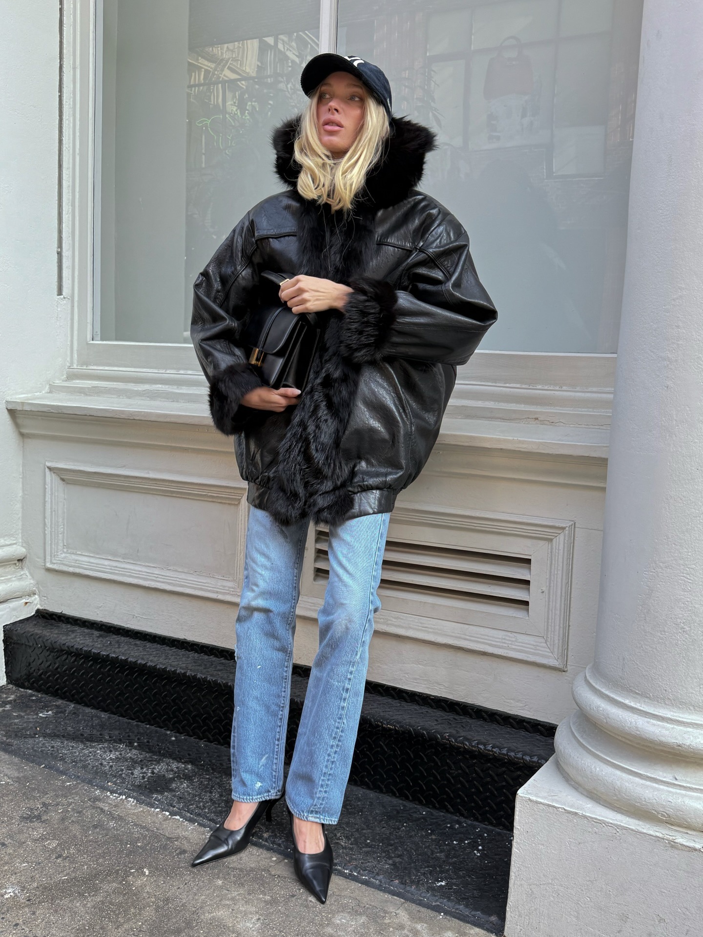 Elsa Hosk wearing light-wash jeans and heels