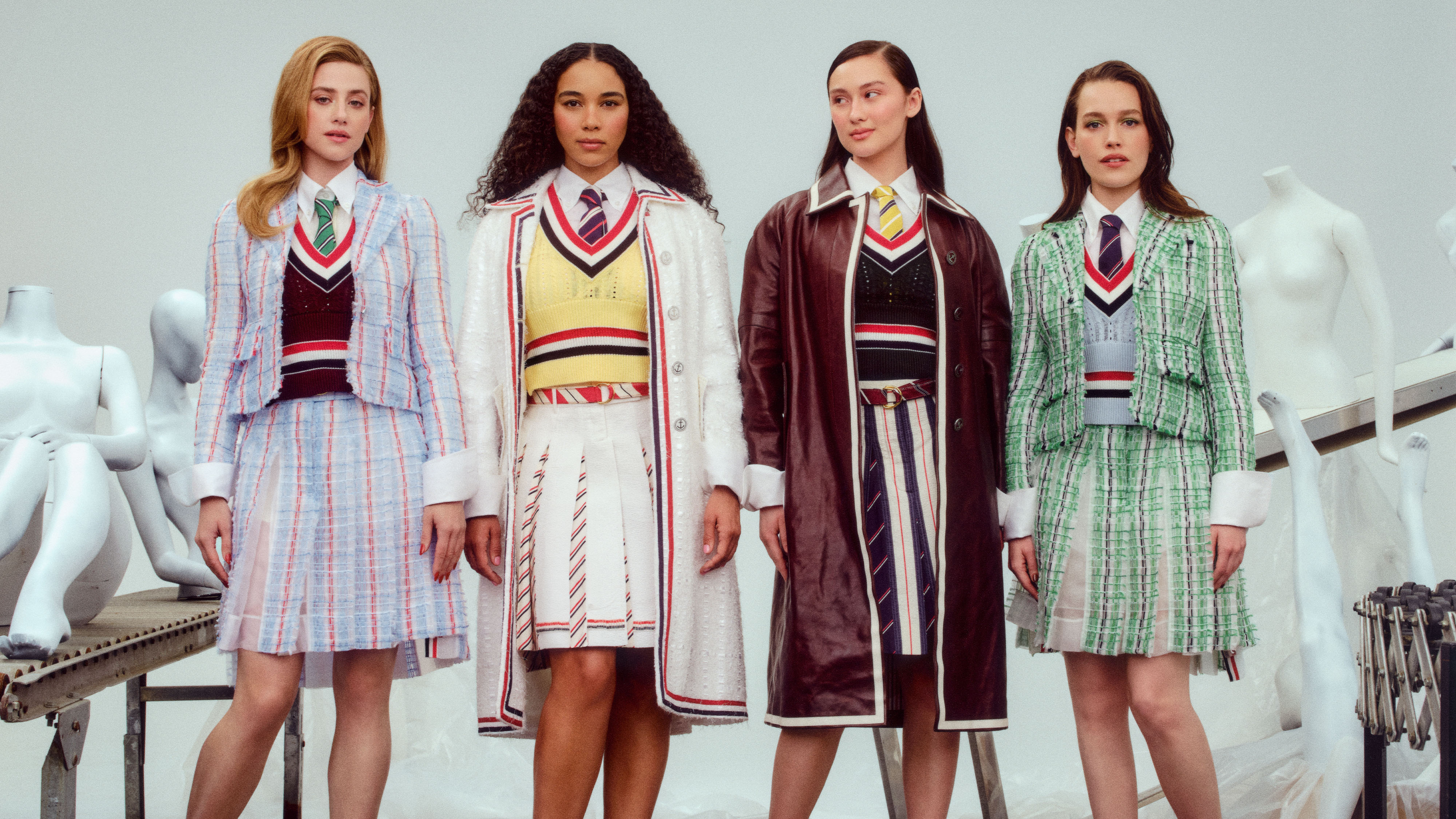 Cast of Forbidden Fruits for Who What Wear's 2026 Spring Issue wearing different tweed suits in front of a cream background. 