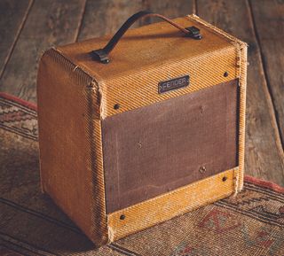 A photo of a vintage 1950s tweed Fender Champ. This is the so-called "wide-panel" Champ introduced in 1953.