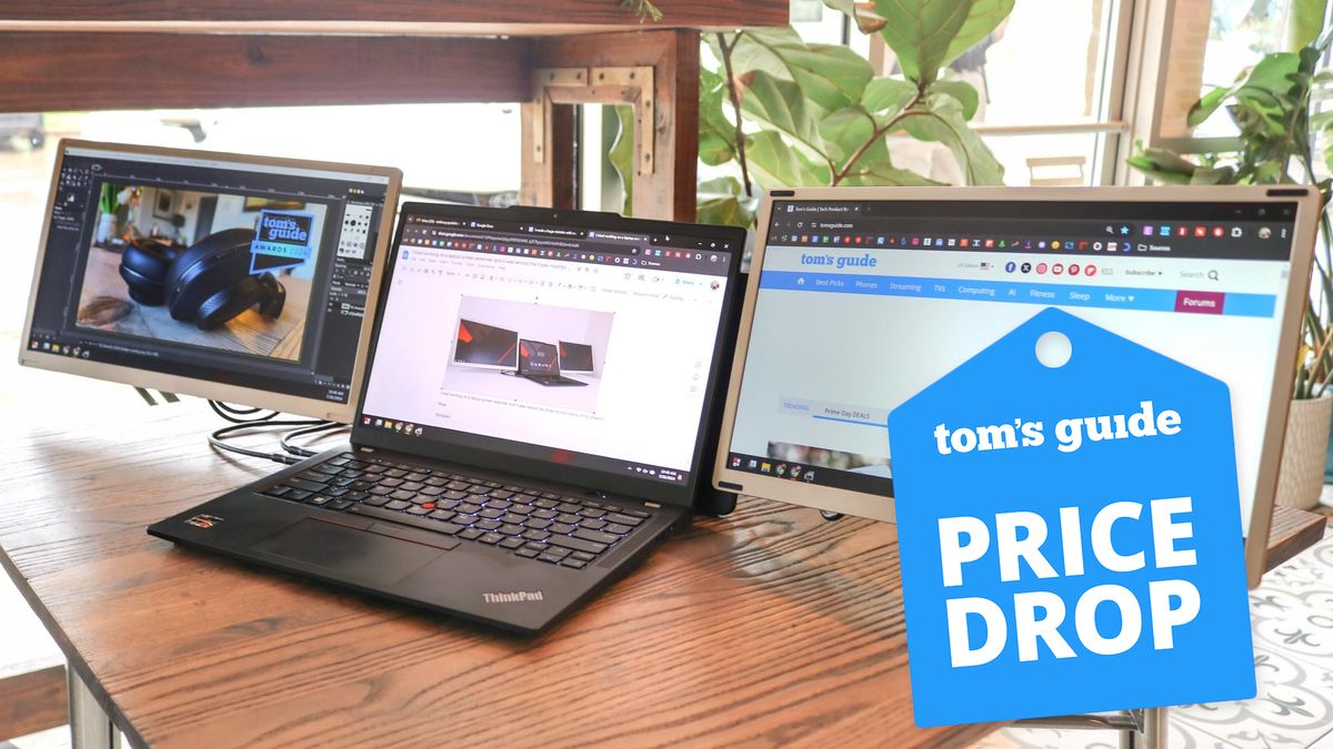 The Siaviala S6 laptop screen extender connected to a laptop on a table in a cafe with a Tom&#039;s Guide deals badge