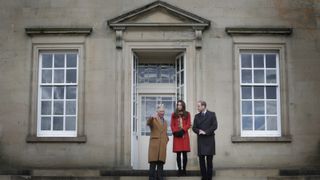 King Charles, Kate Middleton and Prince William standing outside of Dumfries House