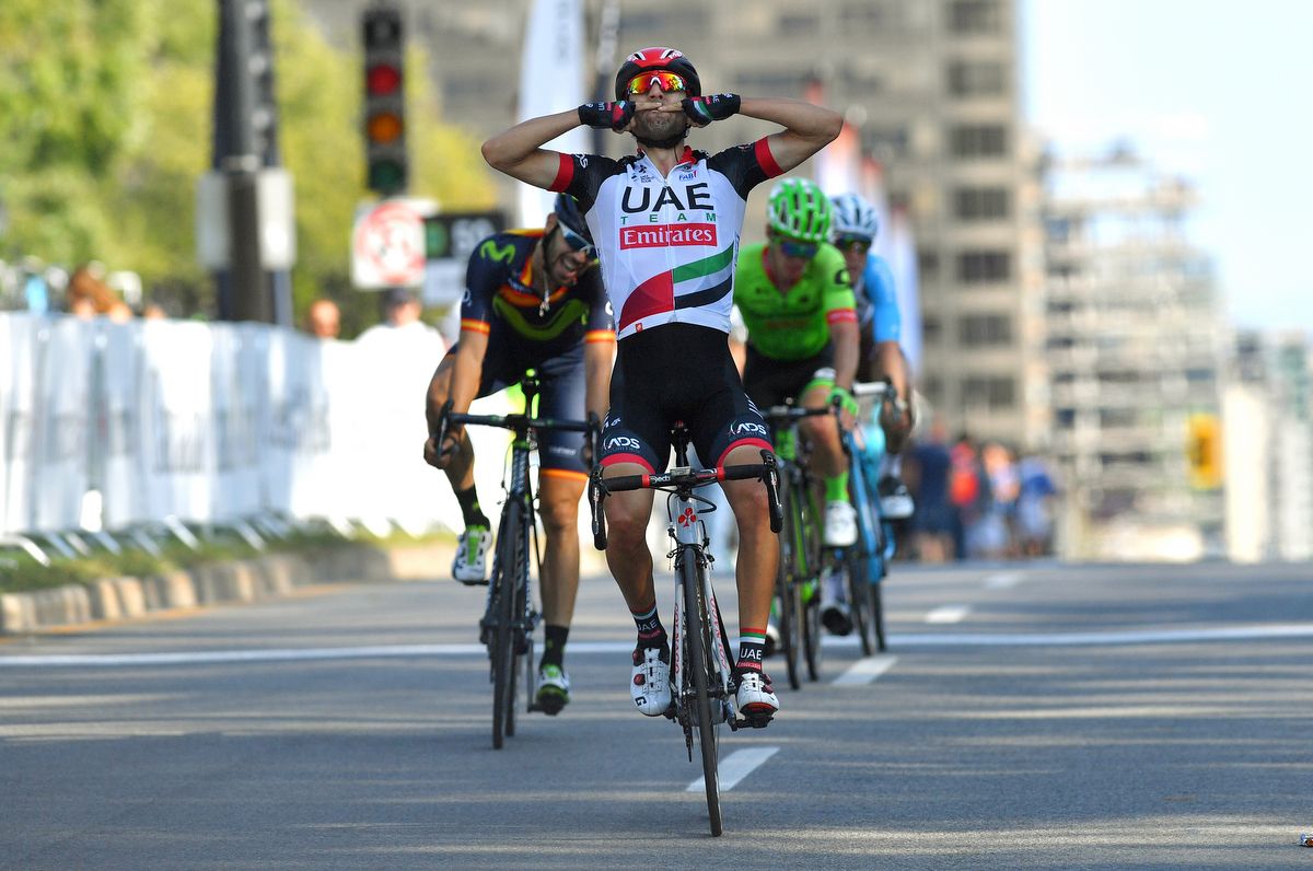 Diego Ulissi (UAE Emirates) kisses his fingers in celebration