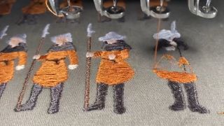 Scarlet Deer Inn knight figure embroidered on cloth