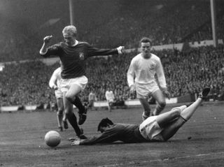 Leicester City goalkeeper Gordon Banks dives at the feet of Manchester United's Denis Law in the 1963 FA Cup final.