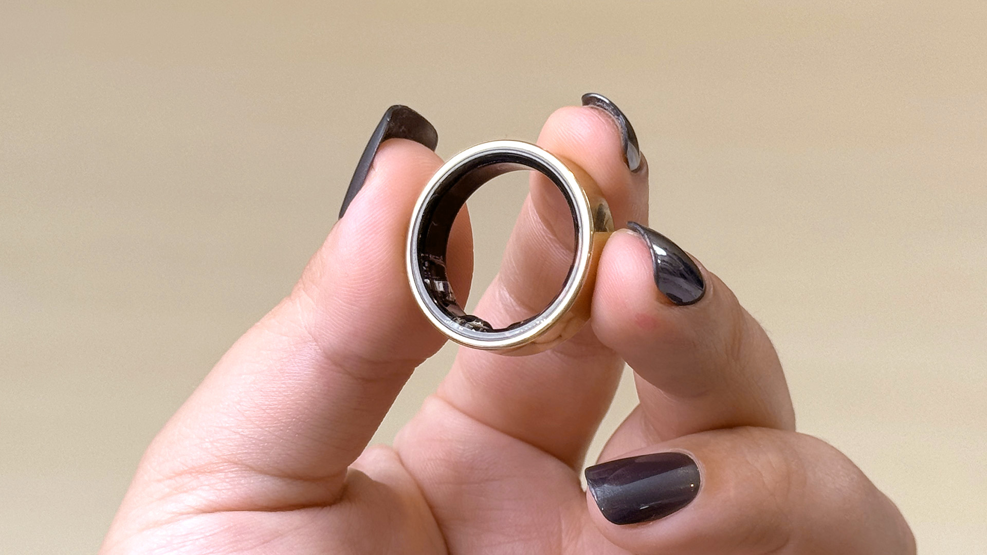 Close-up of the Samsung Galaxy Ring in a user's hand