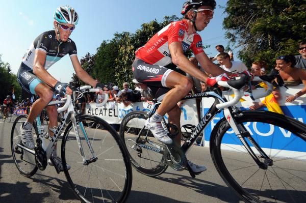 Andy Schleck (Leopard Trek) and Nicky Sorensen (Saxo Bank Sungard) sweat it out on the Mur de Huy.