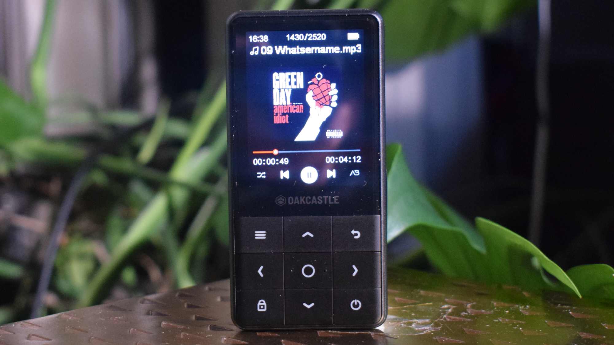 The Oakcastle MP300 on a table, showing a Green Day album artwork.