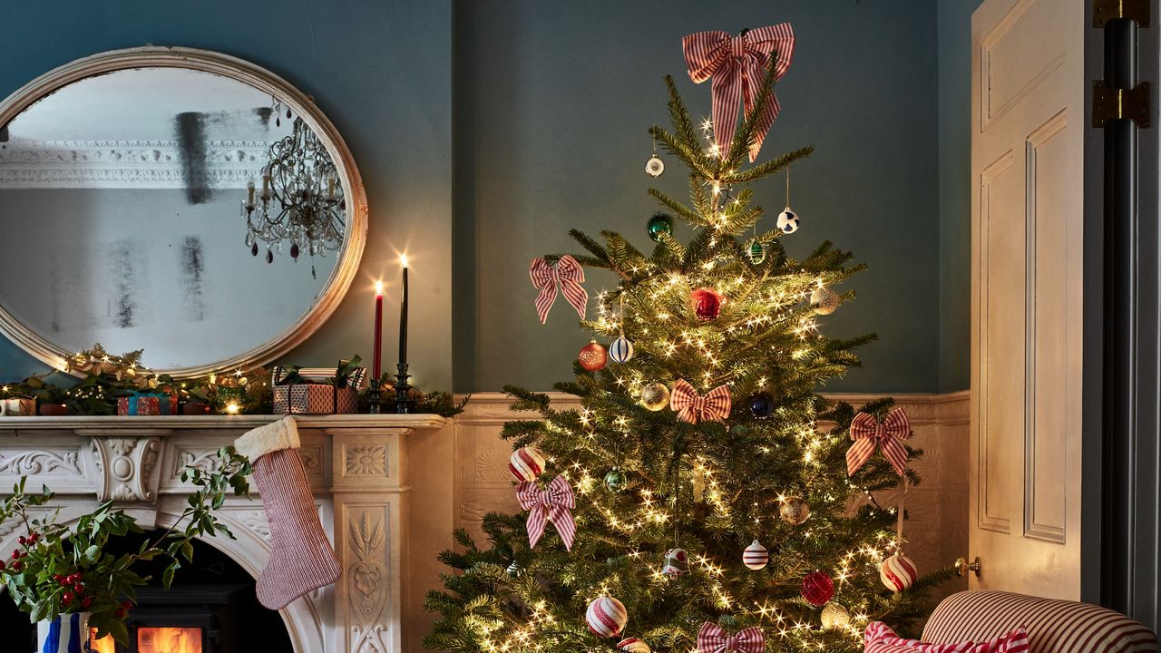 Bow-decorated Christmas tree in a living room