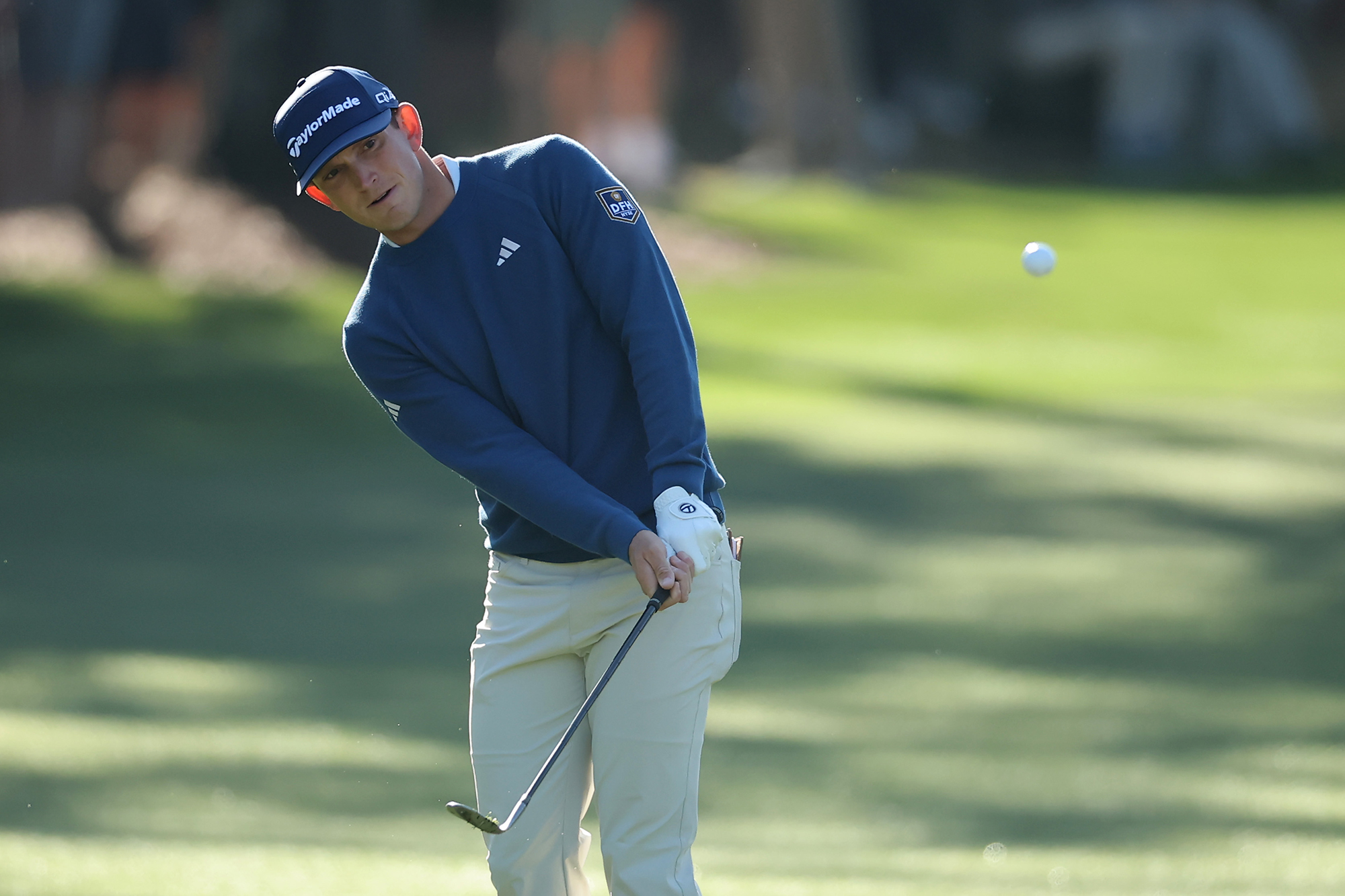 Jacob Bridgeman chipping the ball towards the green