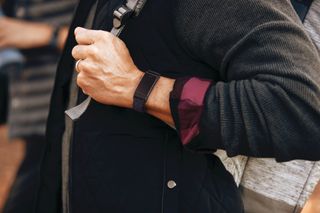 Man wearing Fitbit Charge 4
