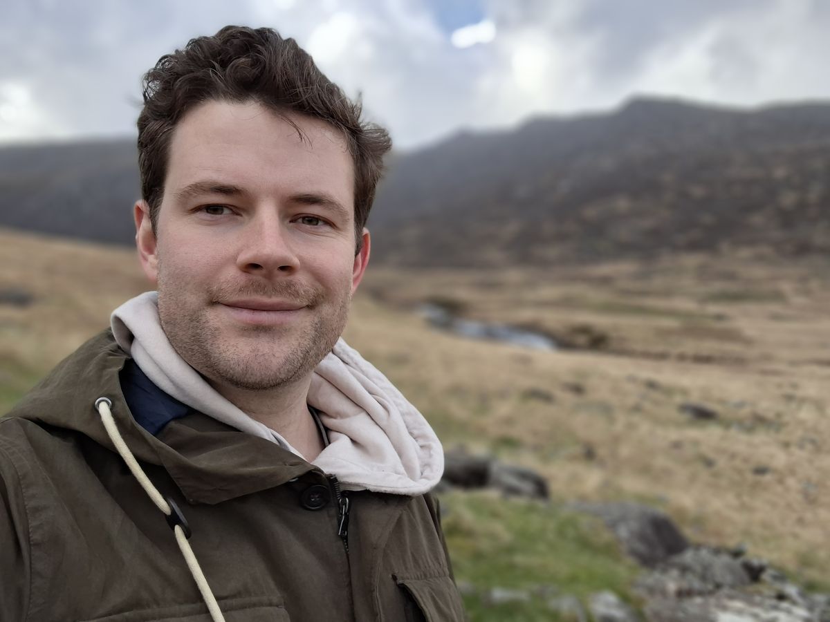 A photo taken on the Samsung Galaxy A57 showing a selfie in Portrait mode.