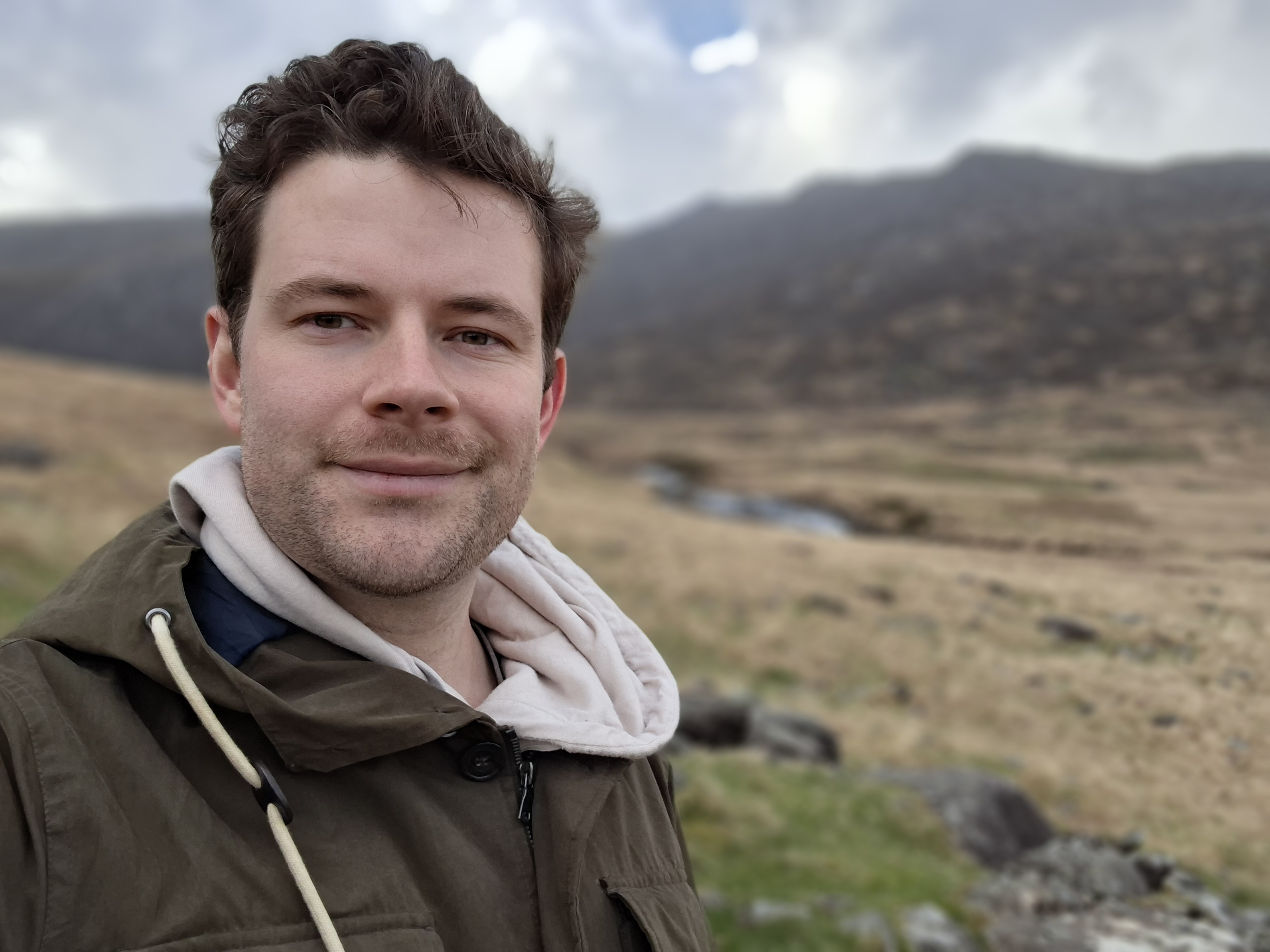 A photo taken on the Samsung Galaxy A57 showing a selfie in Portrait mode.