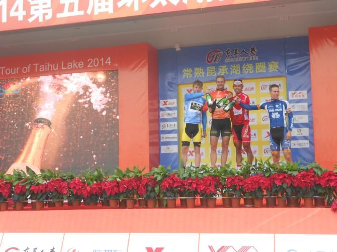 The jersey wearers step onto the podium