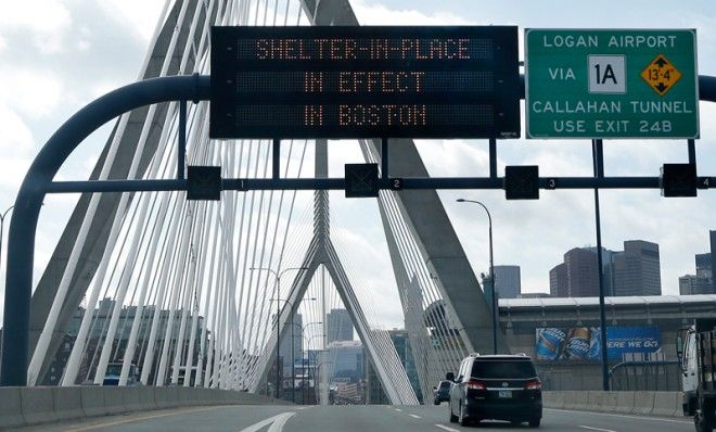 A message calling for citizens of Boston to &amp;quot;Shelter in Place&amp;quot; flashes on a sign on I-93, April 19.