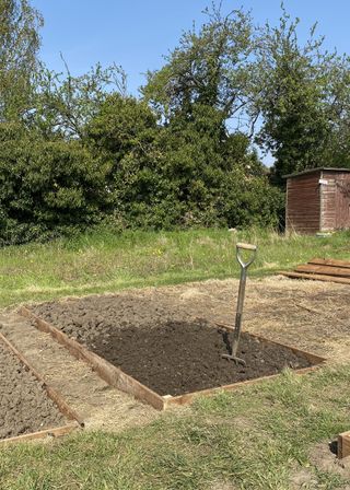 Turning over the soil in raised bed