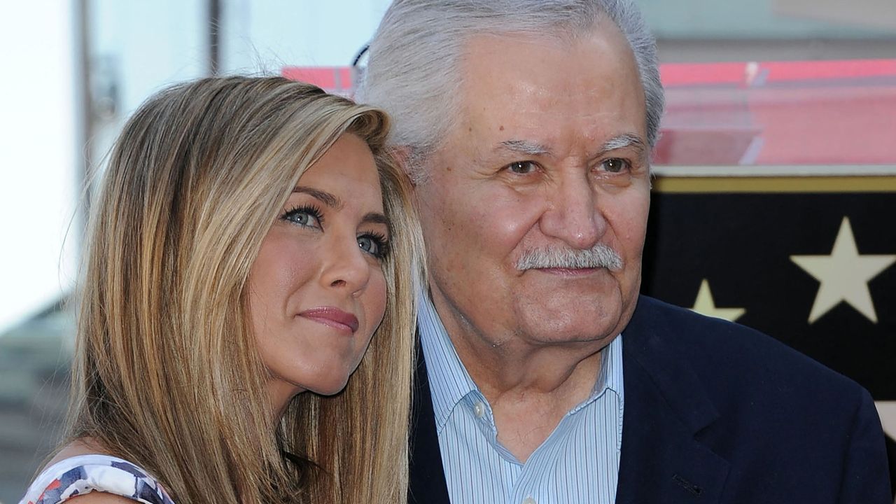 US actress Jennifer Aniston (L) stands for a photo with her father, Greek-US actor John Aniston, during her Hollywood Walk of Fame star ceremony in Hollywood, California, on February 22, 2012