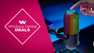 Razer Seiren V3 Chroma USB microphone with reactive RGB lighting, shown on a gaming desk setup alongside a keyboard and monitor.