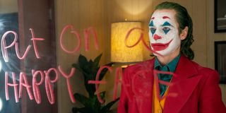 Joker Joaquin Phoenix Put On A Happy Face written on mirror DC Warner Bros.