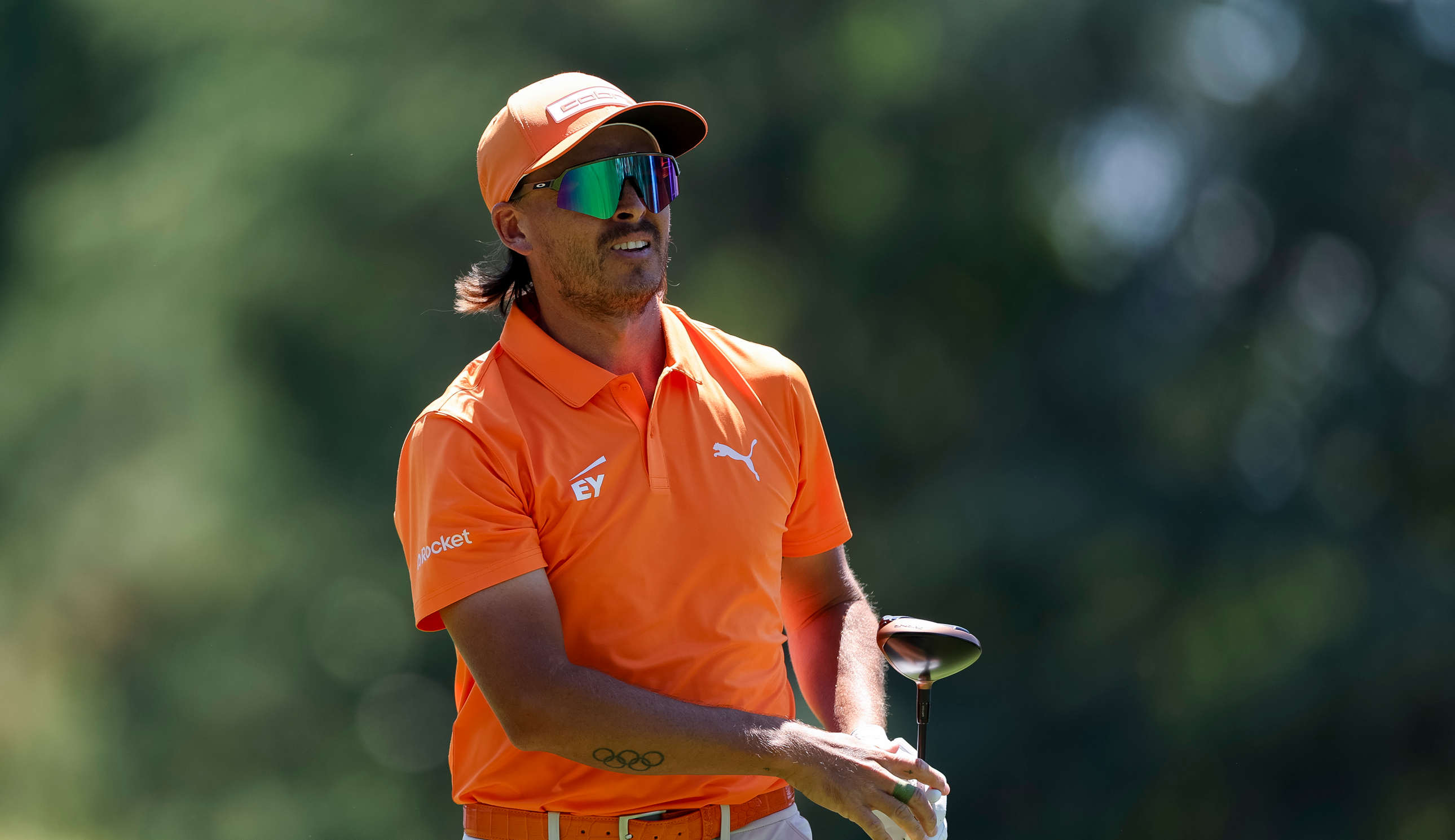 Rickie Fowler watches his tee shot