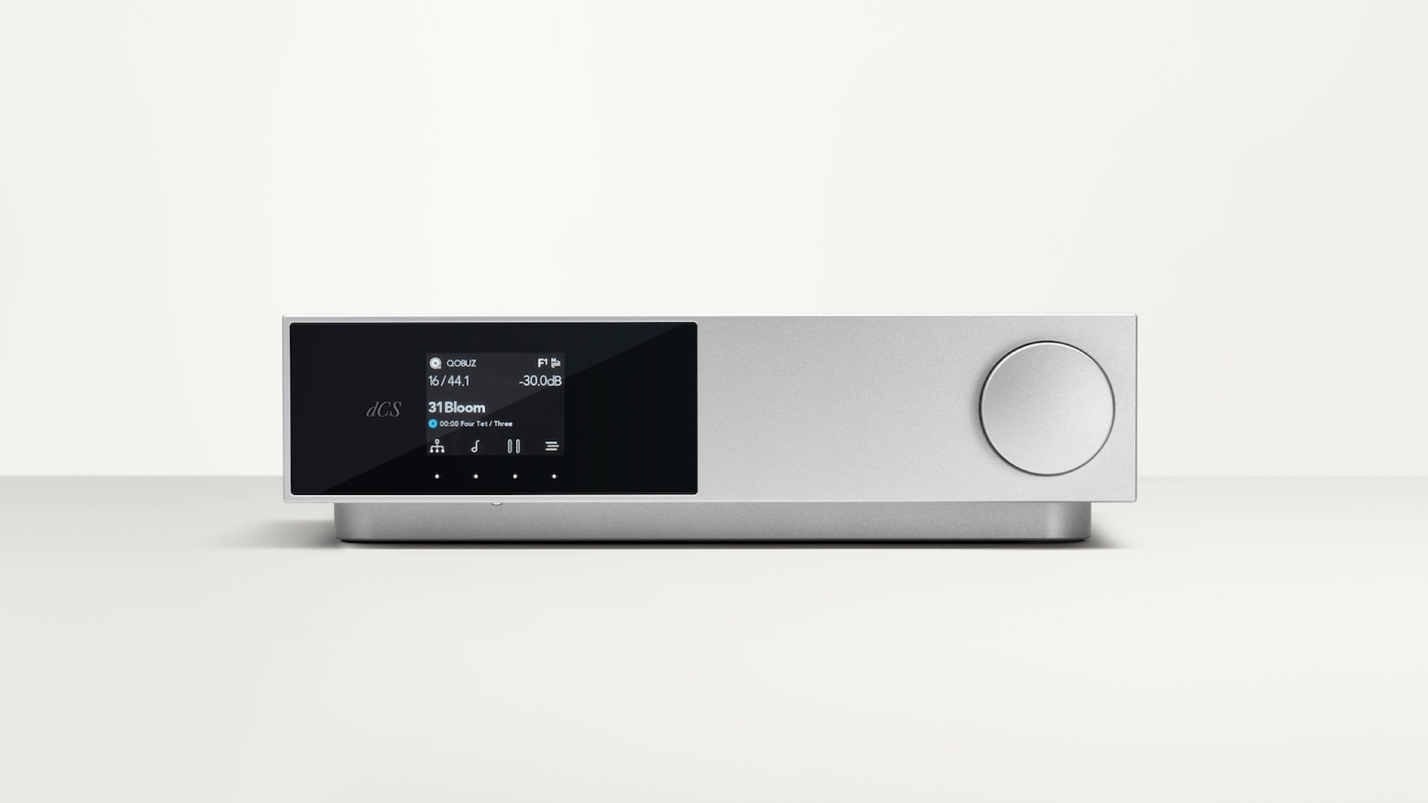 Product photography of the dCS Lina DAC X. A front view on a grey surface with a lighter grey background.