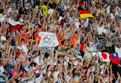 Olympic fans cheer during the Athens Olympics in 2004.