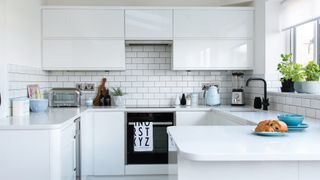 contemporary high gloss white kitchen to show timeless white as key kitchen trend 2023